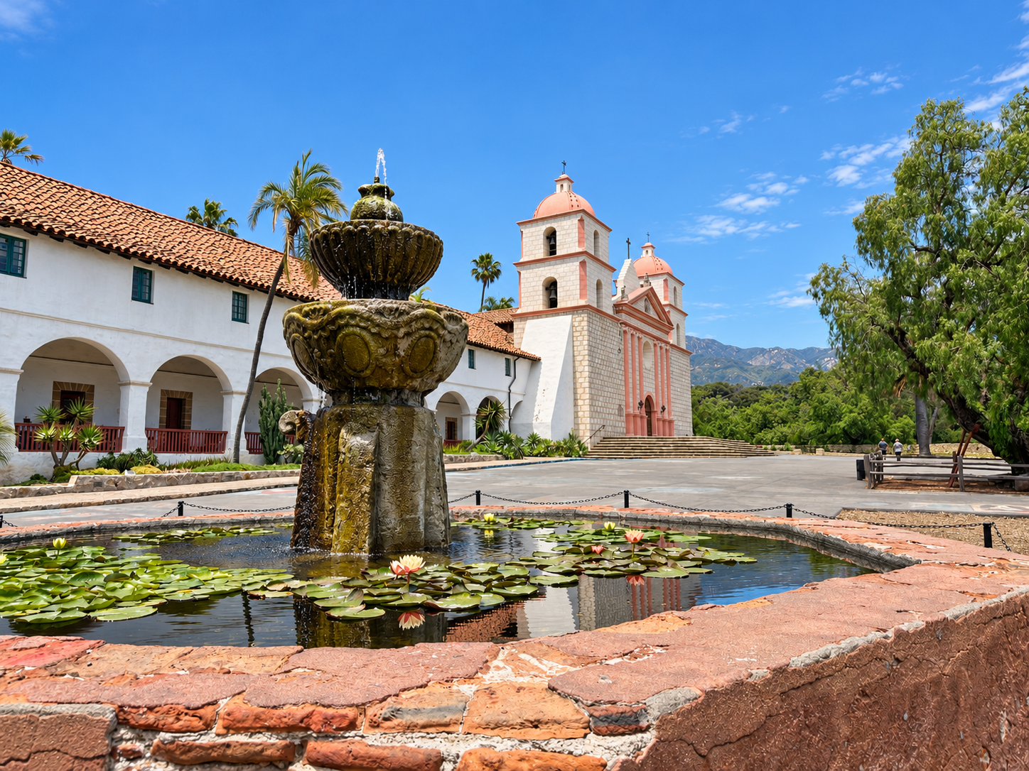 Santa Barbara Mission and its fountain beneath a blue sky